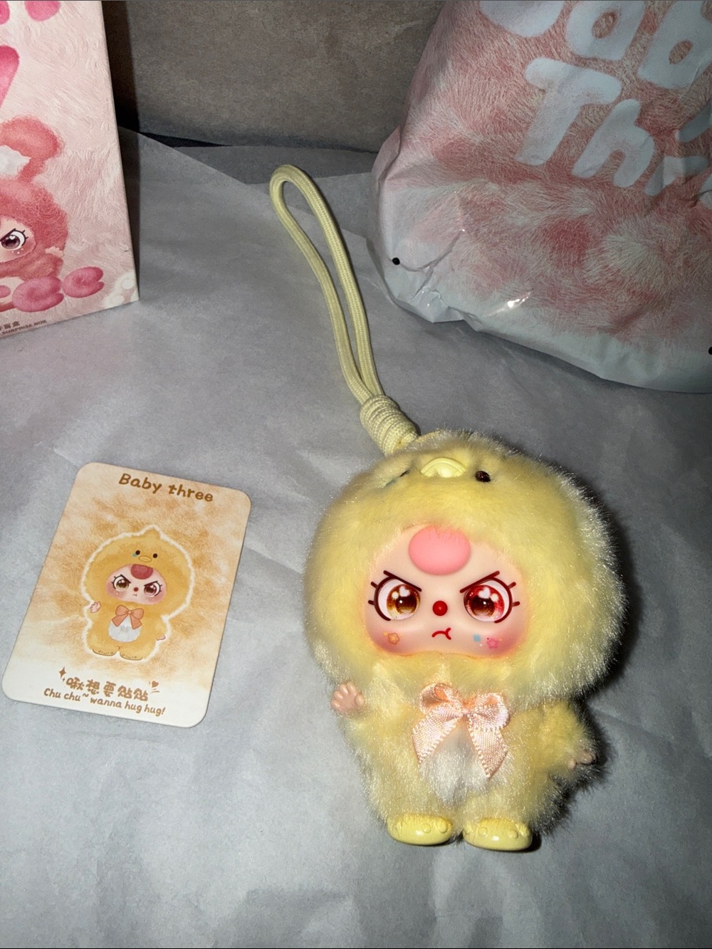 Yellow Plush Baby Character Keychain with Pink Bow